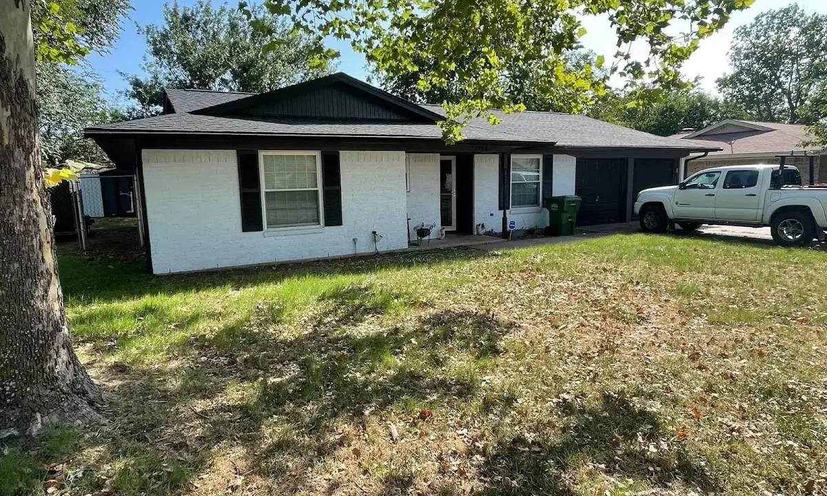Professional roofing crew working on a residential roof in Fort Madison